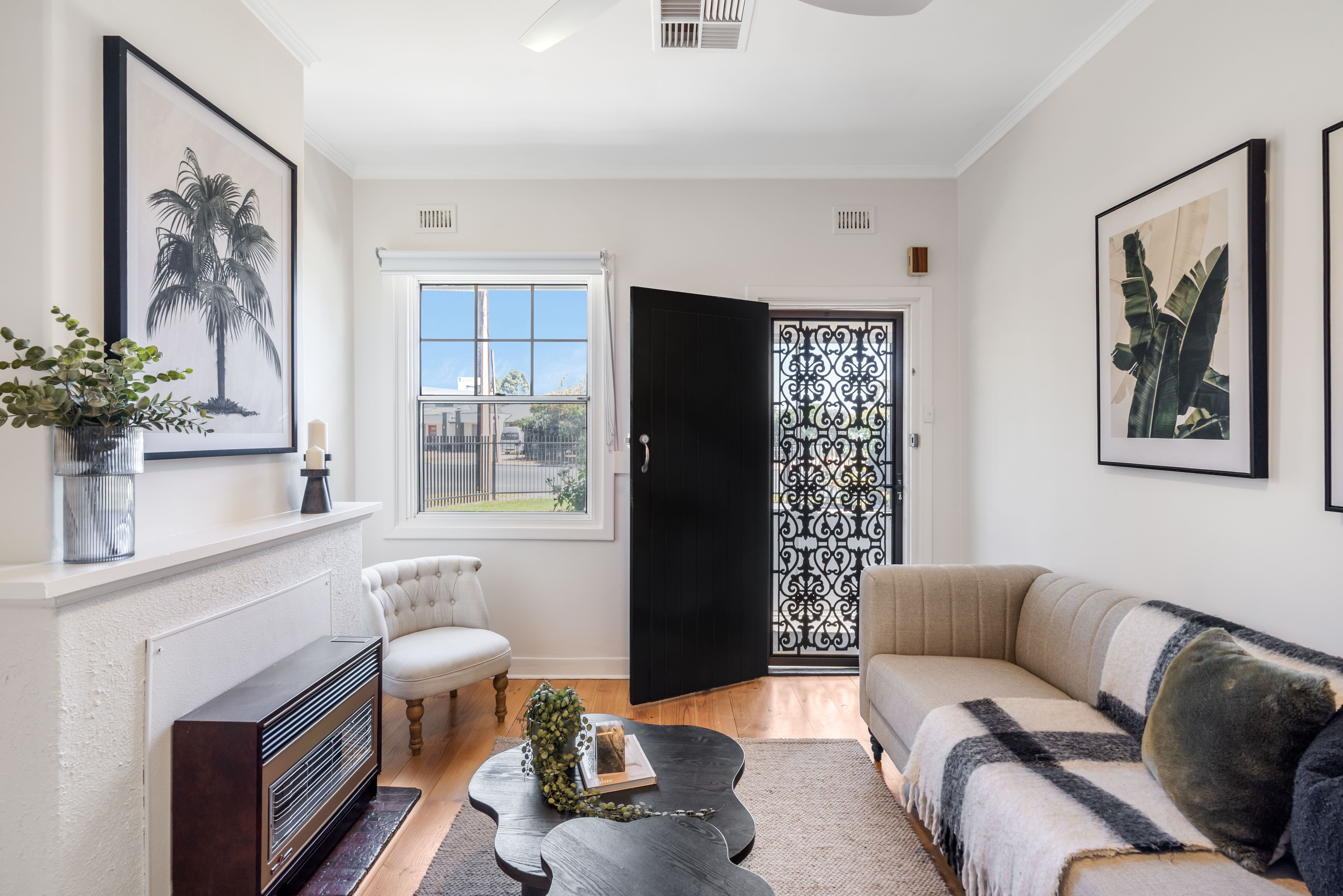 Entry living area with ornate screen door